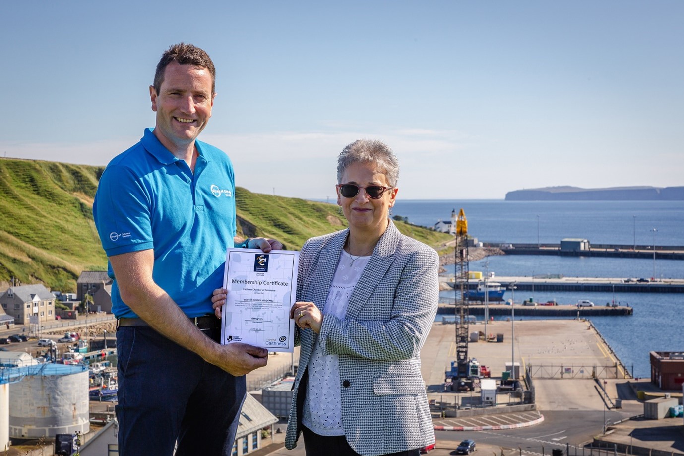 Jack Farnham Development Manager West of Orkney Windfarm with Trudy Morris, CEO, Caithness Chamber of Commerce at Scrabster Harbour.